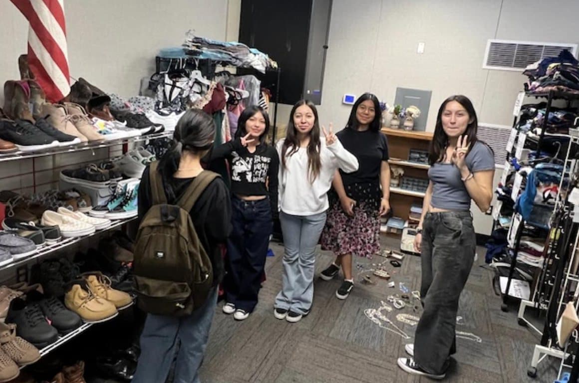 Students browsing clothing and shoes in the JAG Closet.